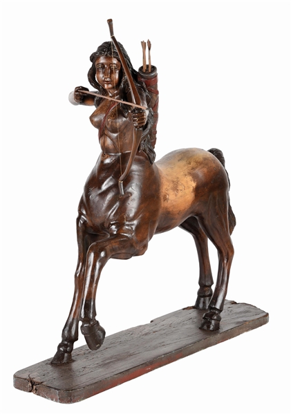 WOODEN FEMALE CENTAUR WITH BOW.