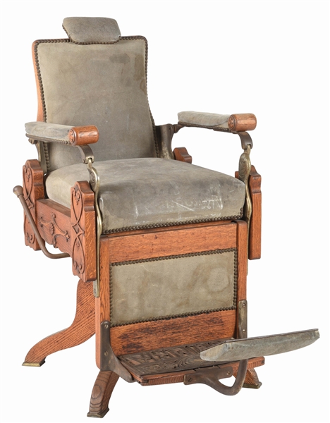 EARLY WOODEN AND UPHOLSTERED KOCHS COLUMBIA BARBER CHAIR.