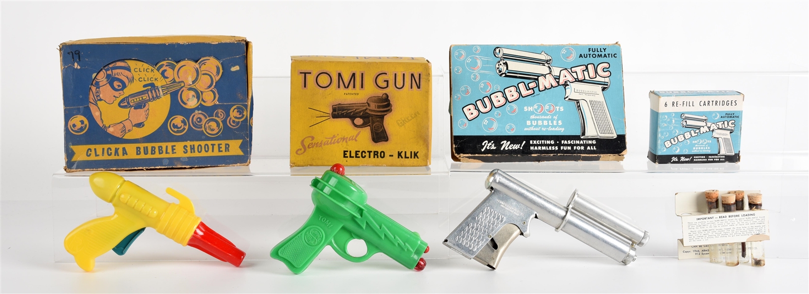 LOT OF 4: AMERICAN MADE PLASTIC & METAL TOY GUNS IN ORIGINAL BOXES.