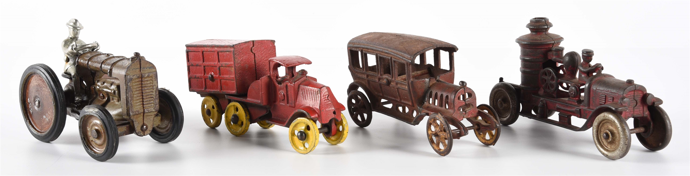 LOT OF 4: VARIOUS AMERICAN-MADE CAST IRON VEHICLES.
