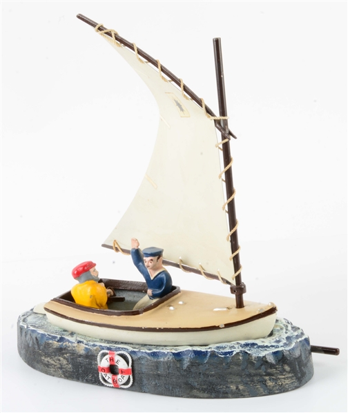 CAST IRON SAILSHIP BOAT WITH 2 FIGURES.