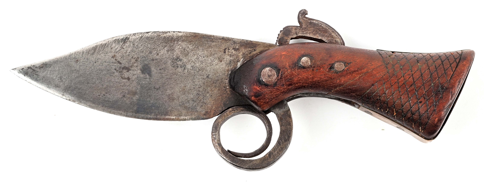 VERY EARLY PRIMITIVE KNIFE IN THE SHAPE OF A PISTOL.