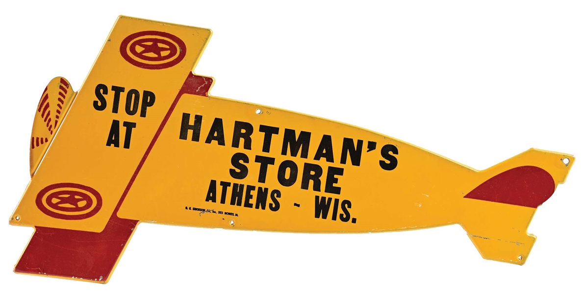 HARTMANS STORE DIE-CUT TIN AIRPLANE SIGN.