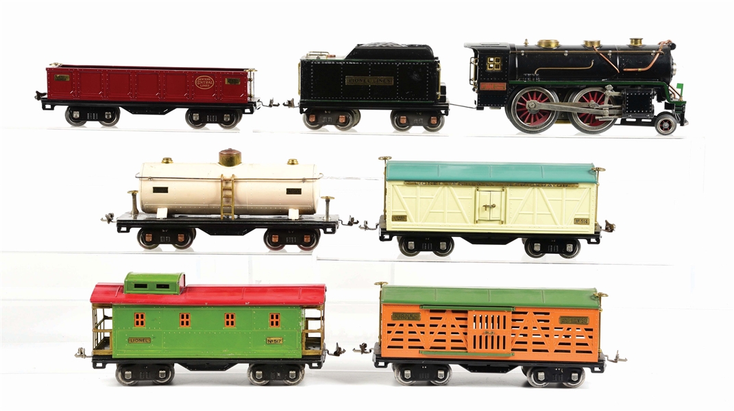 LOT OF 7: LIONEL NO. 384 W/ ASSORTED FREIGHT CARS.