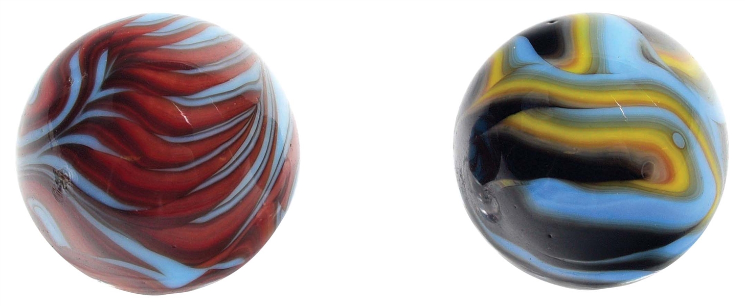 LOT OF 2: CHRISTENSEN AGATE TRI AND FOUR COLOR FLAME MARBLES.
