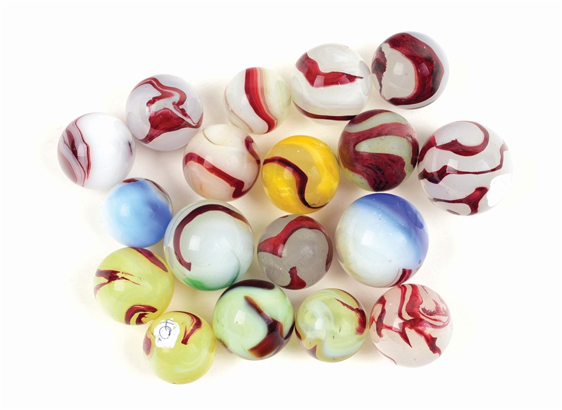 LOT OF 18: OXBLOOD MARBLES.