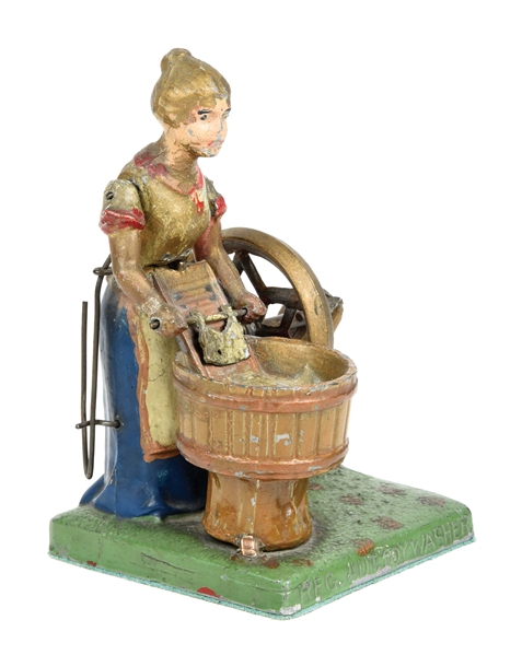 VERY UNUSUAL EARLY CAST IRON WOMAN WASHING CLOTHES STEAM ACCESSORY TOY.