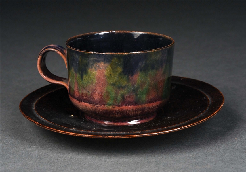 GEORGE OHR (1857-1918) “THE MAD POTTER OF BILOXI”, GLAZED EARTHENWARE CUP & SAUCER