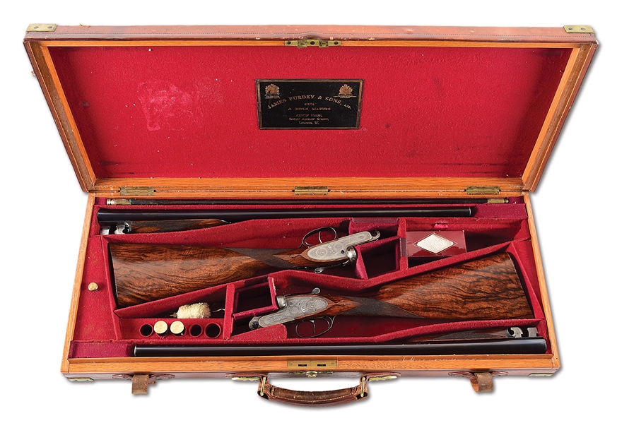 (C) COMPOSED PAIR OF GOLDEN AGE JAMES PURDEY & SONS 12 BORE BEST QUALITY SLE 12 GAUGE GAME SHOTGUNS WITH MAKERS CASE.