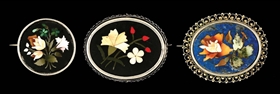 LOT OF 3: STERLING SILVER INLAID FLORAL BROOCHES.