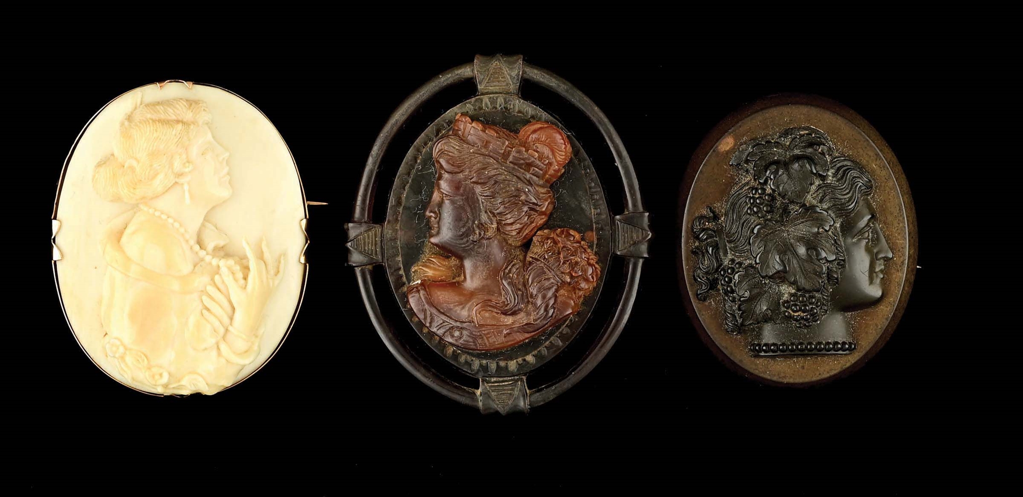 LOT OF 3: ANTIQUE CARVED CAMEO BROOCHES.