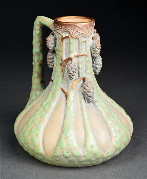 PAUL DACHSEL EARTHENWARE CARVED TREES AND APPLIED PINCONE EWER.