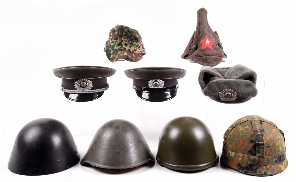 LOT OF 9: COLD WAR EUROPEAN HATS AND HELMETS.