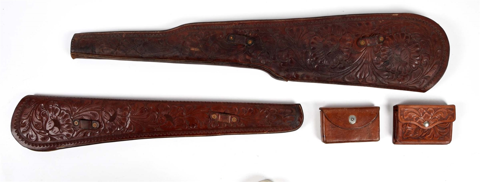 LOT OF 4: TOOLED LEATHER SCABBARDS AND AMMUNITION WALLETS.