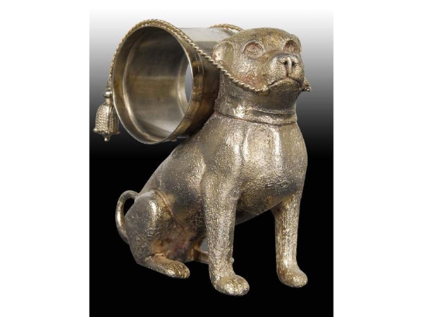 LARGE SEATED DOG WITH FIGURAL NAPKIN RING ON BACK.