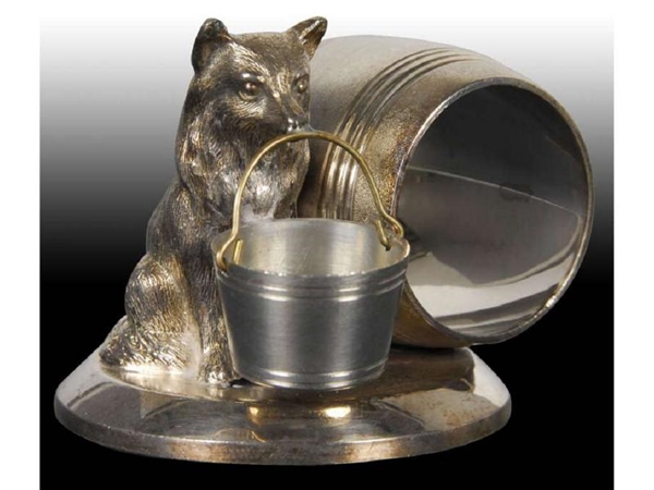 SEATED DOG WITH BUCKET FIGURAL NAPKIN RING.       