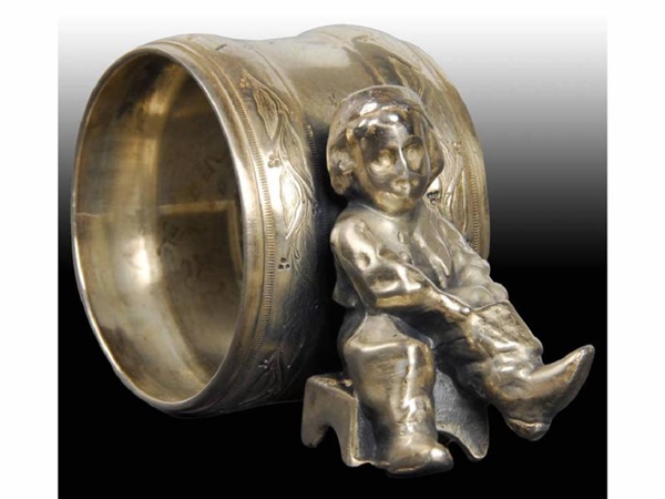 SMALL BOY WITH BOOTS FIGURAL NAPKIN RING.         