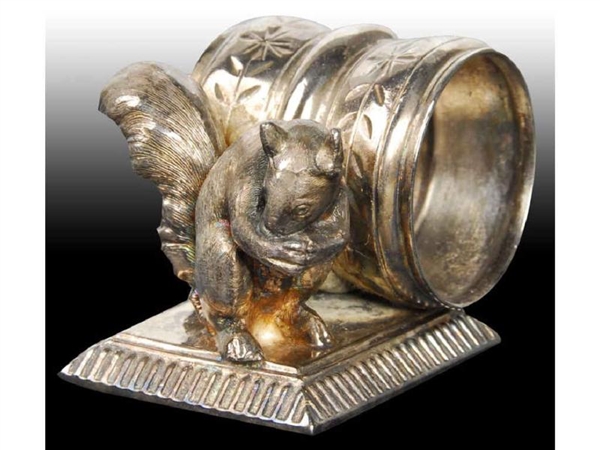 SEATED SQUIRREL WITH NUT FIGURAL NAPKIN RING.     