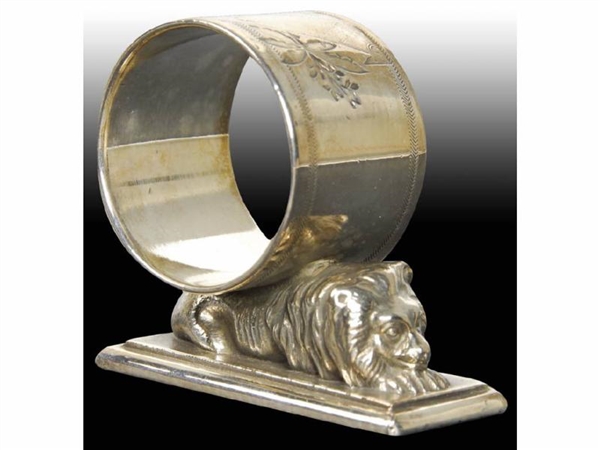 SMALL LION RECLINES ON BASE FIGURAL NAPKIN RING.  