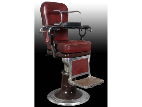 RED LEATHER COVERED BARBER CHAIR WITH CHILDS SEAT.