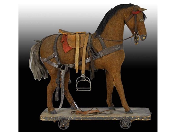 TOY HORSE ON WHEELS WITH ACCESSORIES.             