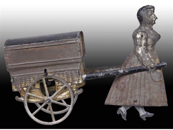 EARLY FRENCH FLYWHEEL WOMAN PULLING CART TOY.     