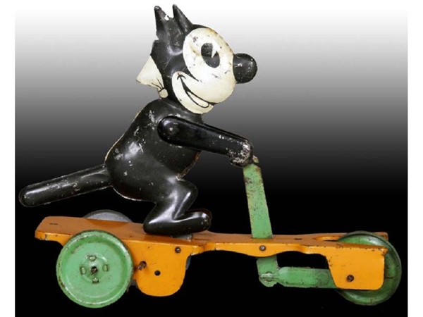 CHEIN TIN WIND-UP FELIX THE CAT SCOOTER TOY.      