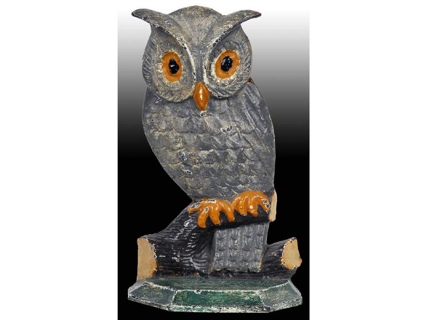 WHIMSICAL OWL ON BRANCH CAST IRON DOORSTOP.       