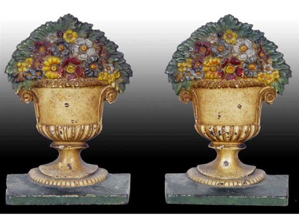 FLOWERS IN URN B & H CAST IRON BOOKENDS.          