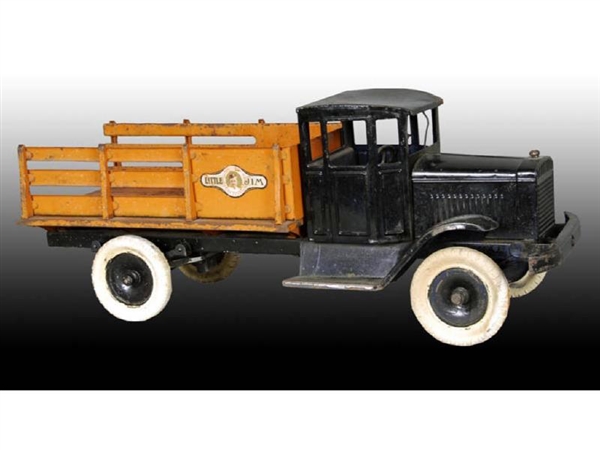 PRESSED STEEL MOTOR DRIVEN STAKE TRUCK TOY.       