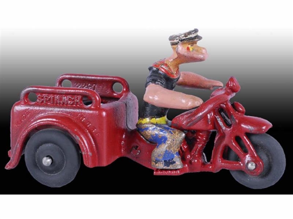 CAST IRON HUBLEY POPEYE SPINACH CYCLE TOY.        