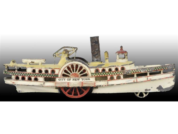 CAST IRON WILKINS SIDE-WHEEL PADDLE BOAT TOY.     