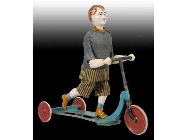 FRENCH MARTIN BOY ON SCOOTER TIN TOY.             