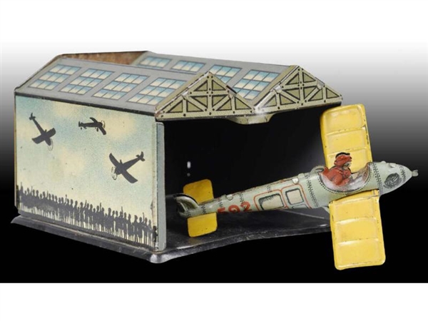 GERMAN TIN PENNY TOY WITH AIRPORT HANGAR.         