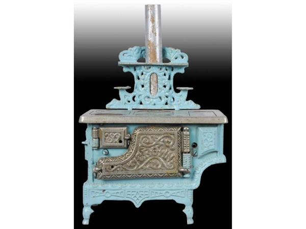 CAST IRON CHILDS STOVE WITH ACCESSORY PANS.      
