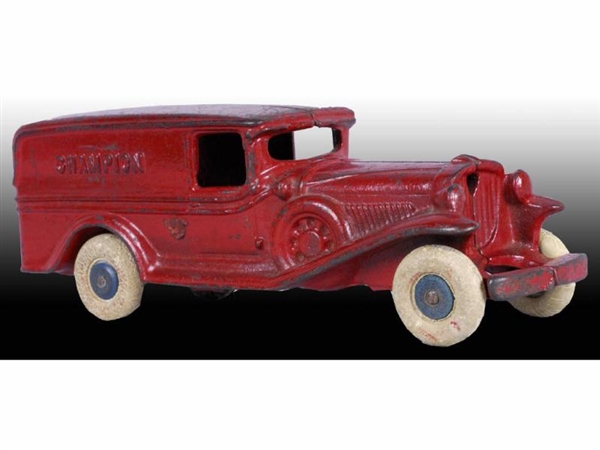 CAST IRON CHAMPION RED PANEL TRUCK TOY.           