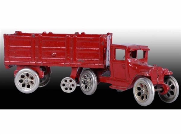 CAST IRON RED ARCADE TRACTOR TRAILER TOY.         