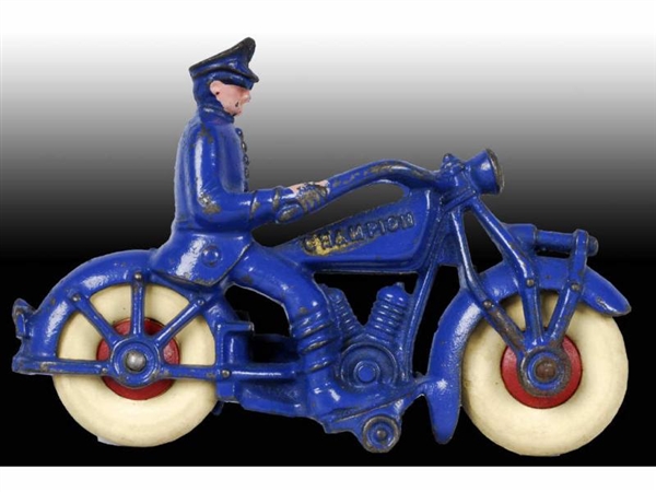 CAST IRON CHAMPION POLICEMAN MOTORCYCLE TOY.      