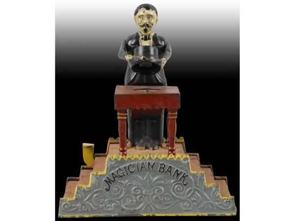 CAST IRON MAGICIAN MECHANICAL BANK WITH ORIG BOX. 