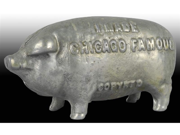 CAST IRON "I MADE CHICAGO FAMOUS" PIG STILL BANK. 