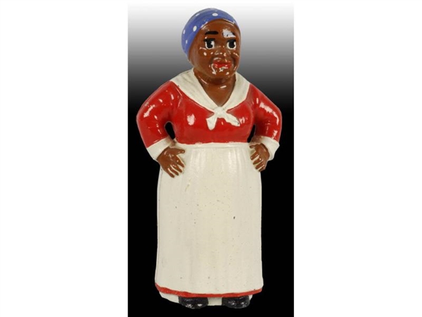 CAST IRON MAMMY WITH HANDS ON HIPS STILL BANK.    