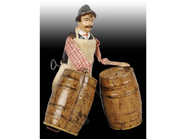 FRENCH MARTIN TIN MAN WITH BARRELS TOY.           