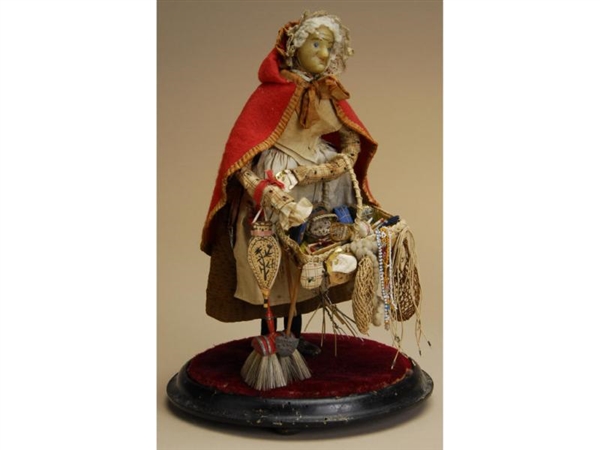WAX OLD WOMAN PEDDLER ON BASE                     