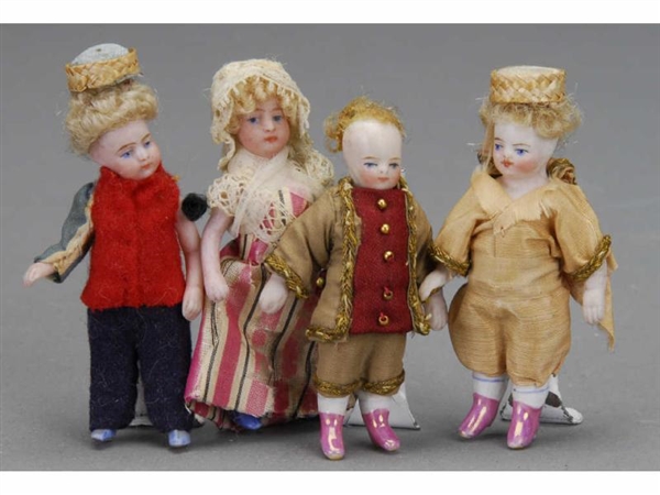 LOT: FOUR SMALL ALL BISQUE DOLLS                  