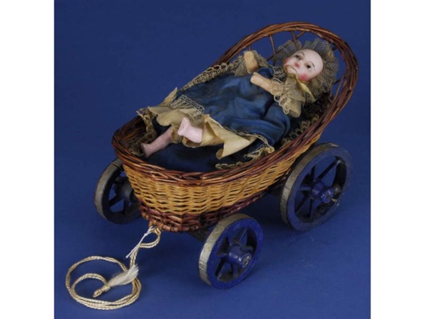 WAX MECHANICAL CHILD IN CARRIAGE PULL TOY         