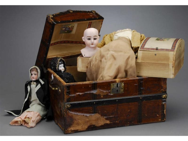 LOT: DOLLS AND DOME-TOP TRUNK                     