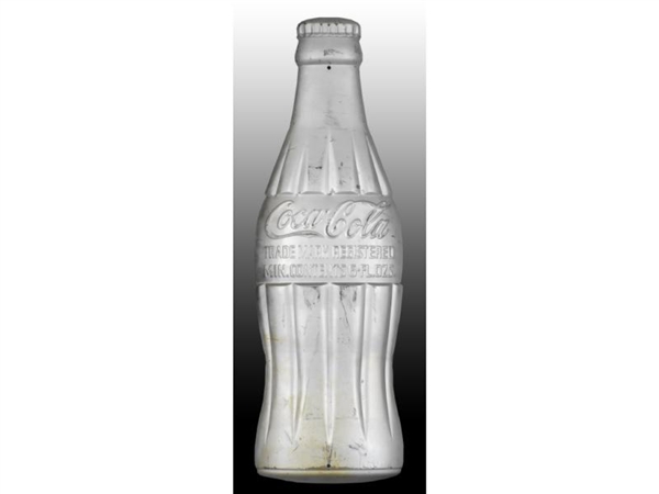 COCA-COLA HEAVILY EMBOSSED SILVER BOTTLE SIGN.    