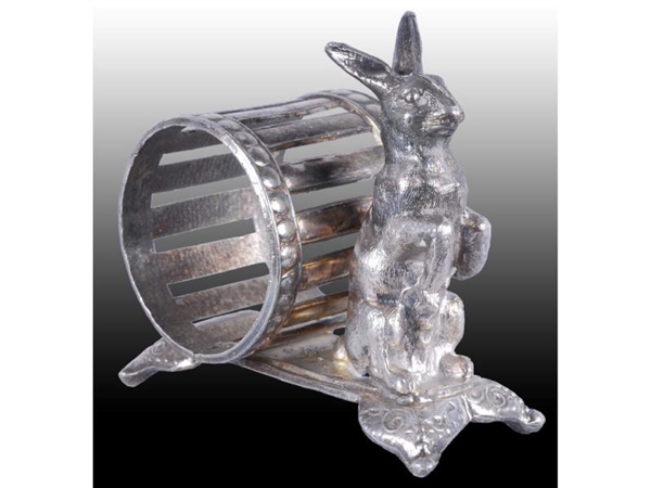 STANDING RABBIT BY OPEN-WORK FIGURAL NAPKIN RING. 