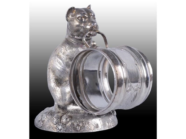 LARGE SEATED DOG CARRYING FIGURAL NAPKIN RING.    