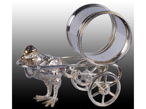 CHICK PULLING FIGURAL NAPKIN RING ON WHEELS.      